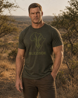 Man wearing an olive Blezbok logo T-shirt outdoors